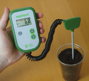 Using a pH meter to test garden soil