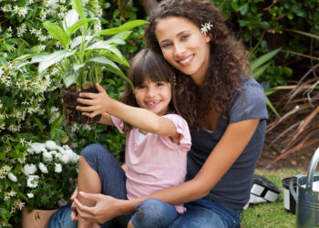 A mother and daughter enjoy the health benefits of gardening